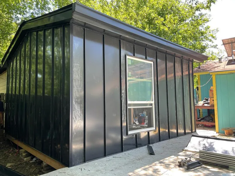 Black standing seam metal wall panels for Metal Roof Installation in Manchester